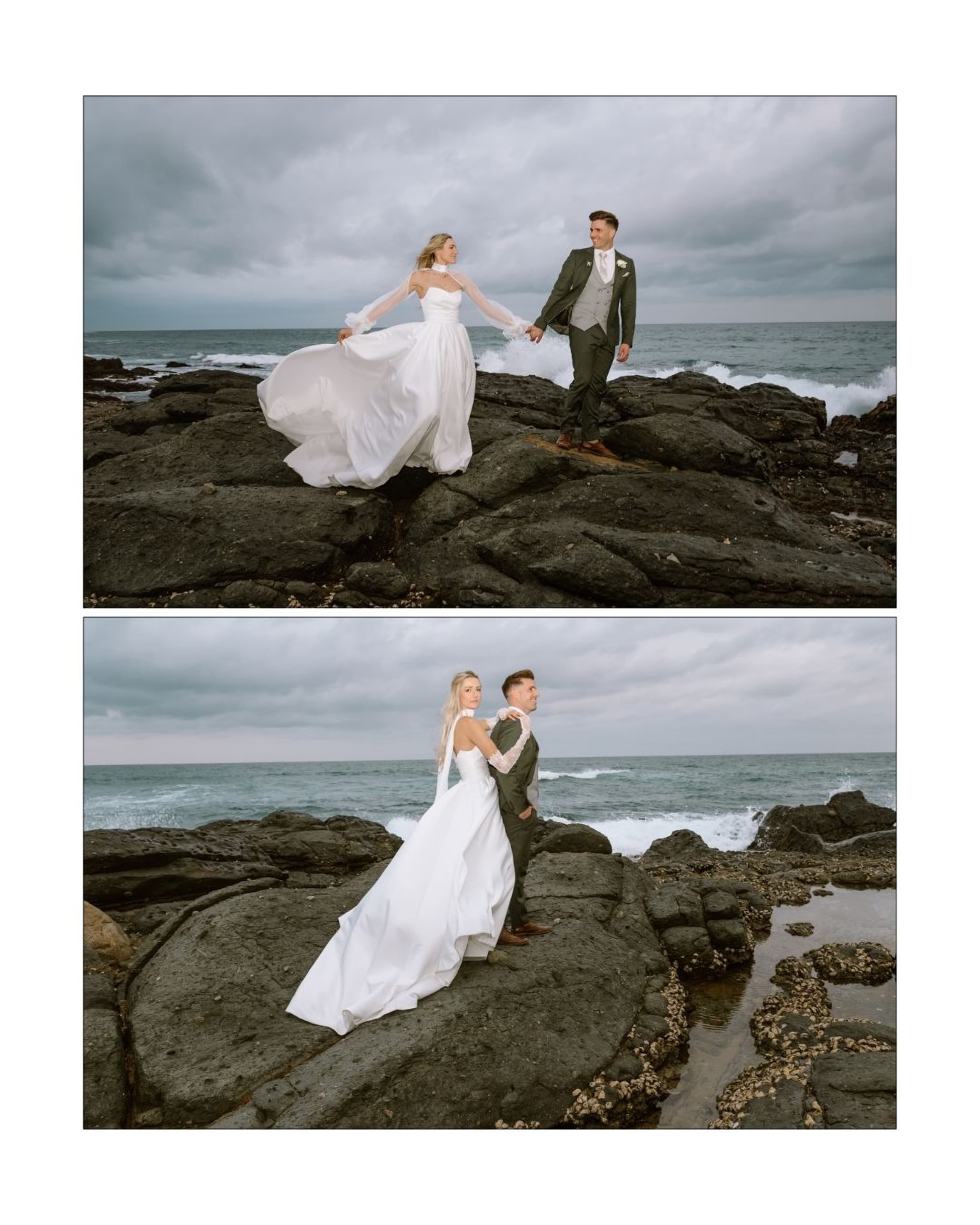 A bride in a white gown and groom in a green suit pose on rocky South African coast under a stormy sky